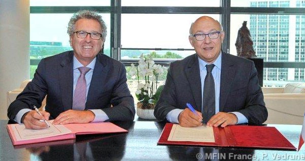 Pierre Gramegna, ministre des Finances luxembourgeois; Michel Sapin, ministre des Finances et des Comptes publics français